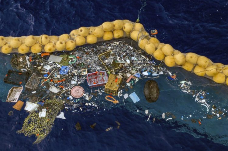 Plastic is retained in front of an extended cork line in the Pacific Ocean. A Dutch inventor Boyan Slat says that after a series of setbacks his system for catching plastic floating in the Pacific between California and Hawaii is now working. 