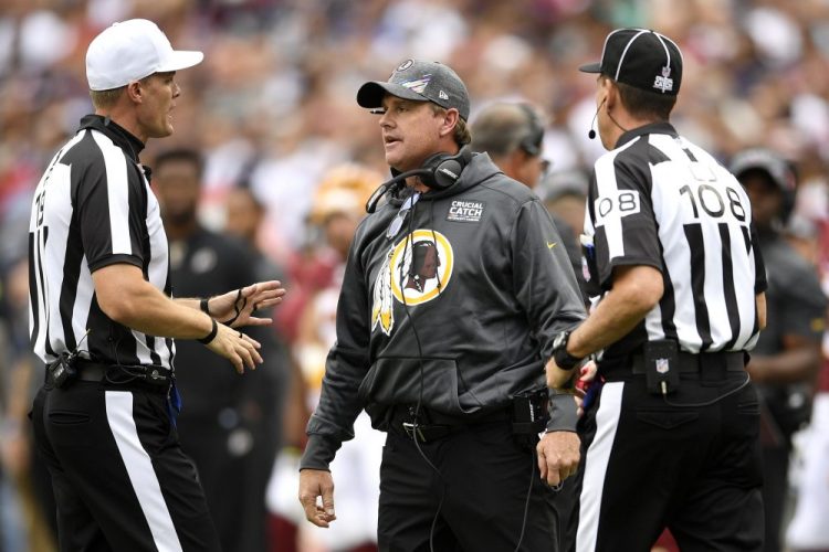 Washington coach Jay Gruden speaks to officials during the first half against the Patriots on Sunday. Gruden was fired on Monday morning after his team started 0-5. 