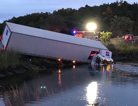 A tractor-trailer truck crashed into the water along Route 1 near the Taste of Maine in Woolwich early Thursday morning. 
