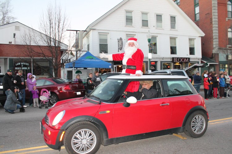 Santa waves to the crowd at a previous Winthrop Holiday Parade. George Szadis, of Winthrop, was his chauffeur.