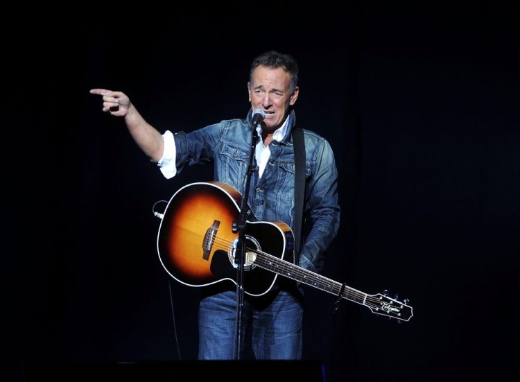 In this Nov. 5, 2018 file photo, Bruce Springsteen performs at the 12th annual Stand Up For Heroes benefit concert at the Hulu Theater at Madison Square Garden in New York. Springsteen surprised moviegoers by introducing his new concert film in his New Jersey hometown. The Asbury Park Press reports Springsteen introduced two showings of "Western Stars" at the AMC Loews Freehold Metroplex Cinema in Freehold on Saturday, Oct. 19, 2019.  