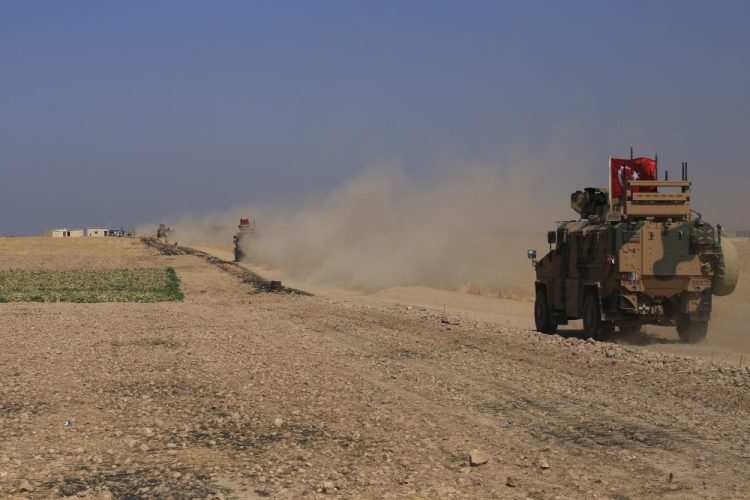 A Turkish armored vehicle patrols as part of a joint ground patrol with American forces in the so-called "safe zone" on the Syrian side of the border with Turkey.