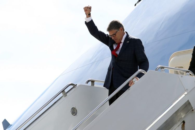 Energy Secretary Rick Perry gestures as he arrives on Air Force One with President Trump at Naval Air Station Joint Reserve Base in Fort Worth, Texas, on Oct. 17. 