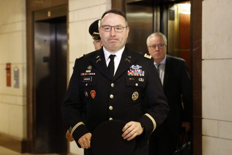 Army Lt. Col. Alexander Vindman, a military officer at the National Security Council, arrives on Capitol Hill on Tuesday to appear before House committees in the impeachment inquiry into President Trump.