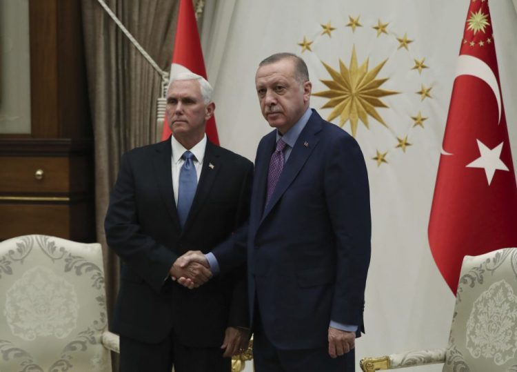 Vice President Mike Pence, left, and Turkish President Recep Tayyip Erdogan pose at the presidential palace in Ankara, Turkey, on Thursday.