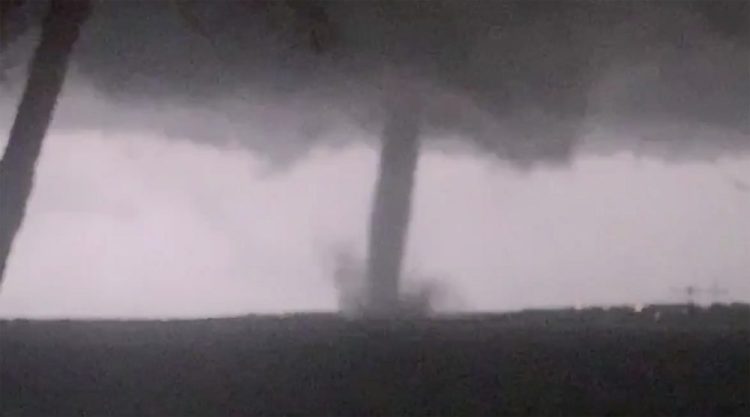 This image made from video by Twitter user @AthenaRising shows the tornado in Rockwall, TX. The National Weather Service confirmed a tornado touched down in Dallas on Sunday night, causing structural damage and knocking out electricity to thousands. 