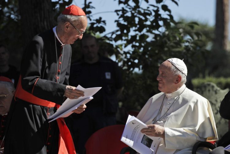 Cardinal Claudio Hummes shares a word with Pope Francis on the occasion of the feast of St. Francis of Assisi, the patron saint of ecology, in the Vatican gardens on Friday.