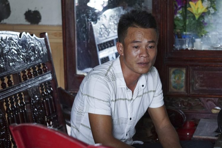 Vo Ngoc Chuyen, brother of Vo Ngoc Nam, speaks to media Sunday at his home in Yen Thanh district, Nghe An province, Vietnam. Chuyen's family fears that Vo Ngoc Nam could be among the people who died in a container in the U.K.