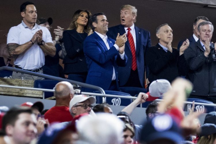 President Trump accompanied by first lady Melania Trump, second from left, and Republican lawmakers, reacts as the crowd boos when he is shown on the jumbo screen during a Salute to the Military during World Series Game 5 Sunday.