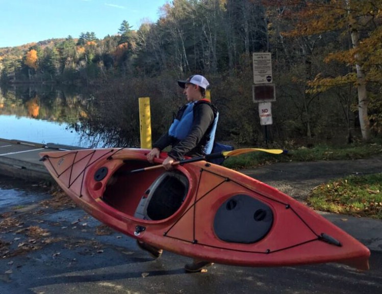 Alanna Wacome hauls her kayak into Lake George on Sunday morning. 