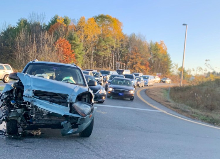 A car's front end is smashed following a crash Thursday morning on the Exit 112 off-ramp for Interstate 95 and Civic Center Drive. 