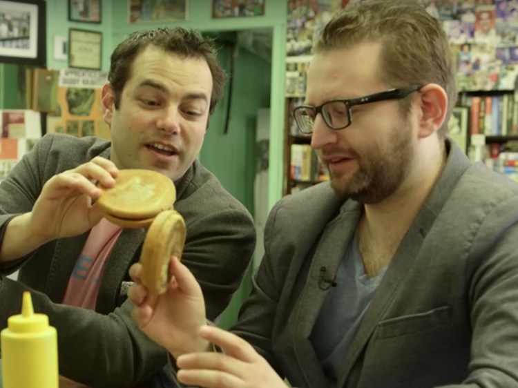 Jamie Elman and Eli Batalion sample salami-baloney sandwiches at Wilensky's in a scene from the documentary "Chewdaism: A Taste of Jewish Montreal." The movie is screening in Portland in November. 