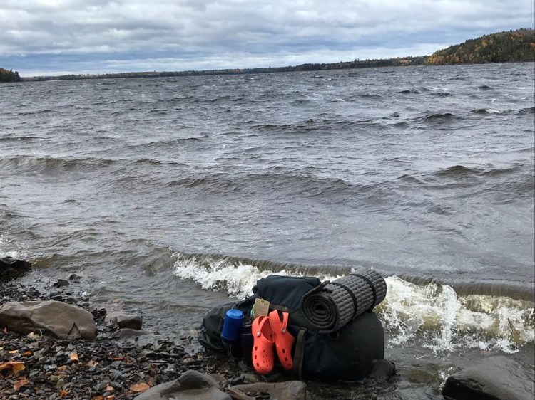 Gear washed ashore on Ripogenus Lake in Piscataquis County, where the Maine Warden Service rescued a group of canoeists after their boats overturned in the wind-whipped waves Friday.