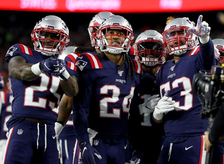 New England's Stephon Gilmore, 24, and teammates celebrate during a win over the New York Giants.