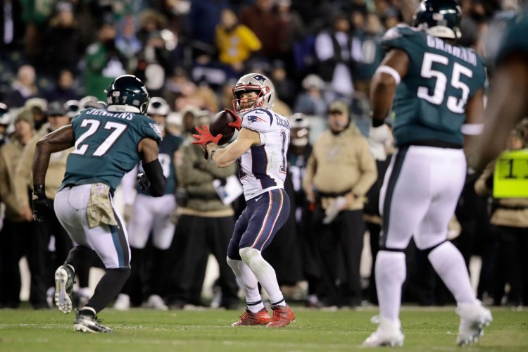 Patriots receiver Julian Edelman throws a touchdown during New England's 17-10 win over the Philadelphia Eagles on Sunday in Philadelphia.