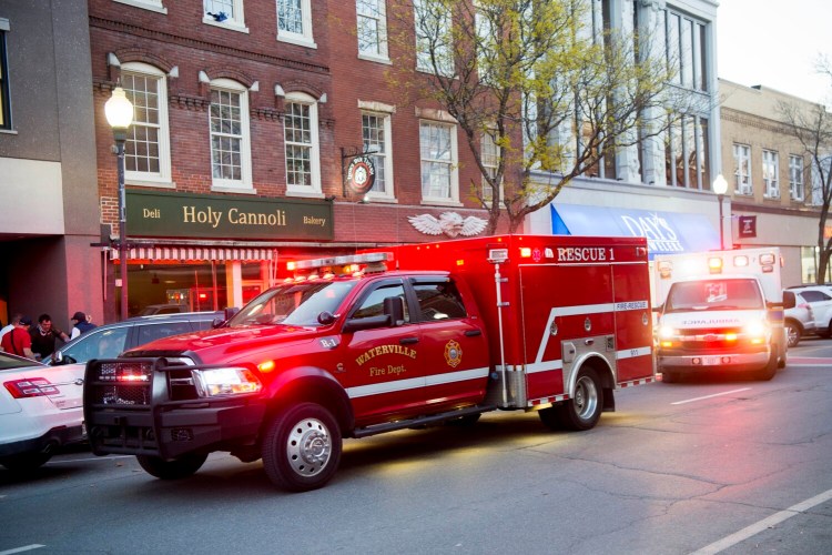 Rescuers from the Waterville Fire Department and Delta Ambulance respond to a medical call on Main Street in downtown Waterville. 