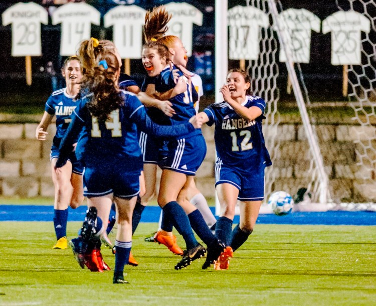 Traip Academy celebrates after a goal by Sophia Sanataria against Maranacook in the first half of the Class C South girls championship Tuesday in Lewiston. 
