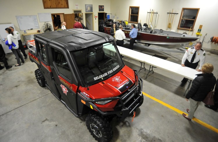 Belgrade firefighters examine a new firefighting ATV and rescue boat Monday at the Belgrade Lakes Fire Department in Belgrade. 
