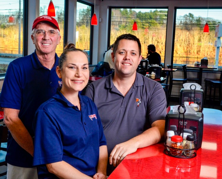 Partners Glenn Steuber, left, Janice Partridge and Glenn Partridge pose for a portrait in the dining room Thursday at their recently opened Cappza's Pizza in Farmingdale.