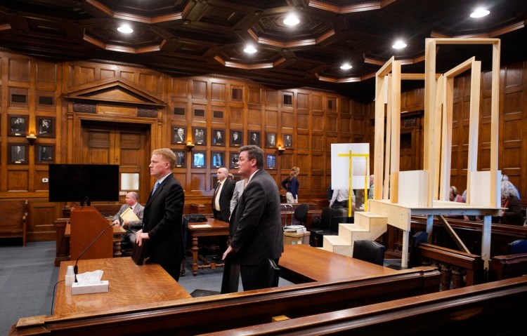 Jim Mason, left, and Jim Andrews, attorneys for Noah Gaston, and others prepare to leave the courtroom Thursday after being told by Justice Michaela Murphy that the room had to be cleared so the jury could come in to review the replica stairs and mock gun that were part of the trial.