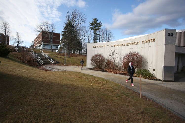 Students walk past the Kenneth T. H. Brooks Student Center on USM's Gorham campus in 2015.