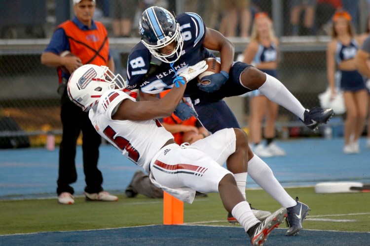 UMaine senior Earnest Edwards makes one of his nine touchdown catches this season. (Staff photo by Ben McCanna/Staff Photographer)