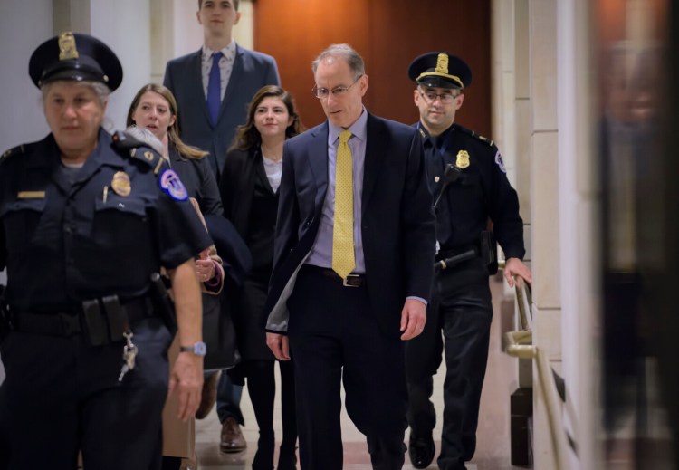Mark Sandy, a career employee in the White House Office of Management and Budget, arrives at the Capitol to testify in the House Democrats' impeachment inquiry on Nov. 16.