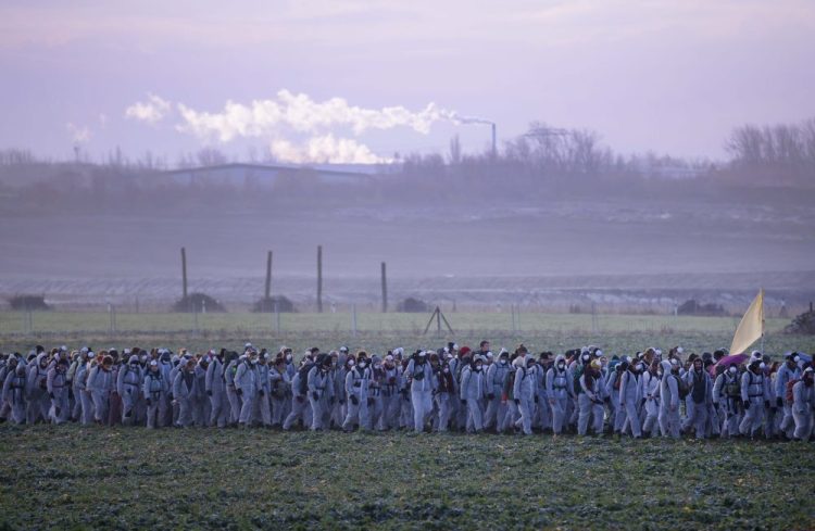 Supporters of the climate movement Ende Gelaende protest in front of a coal-fired power station near Leipzig, Germany, on Nov. 24. Ende Gelaende is an action alliance for an immediate coal exit, climate justice and a fundamental system change. 