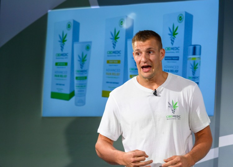 Former New England Patriots tight end Rob Gronkowski holds a news conference announcing his advocacy for CBD and becoming an investor in Abacus Health Products, the maker of CBDMEDIC, Aug. 27, 2019, in New York.