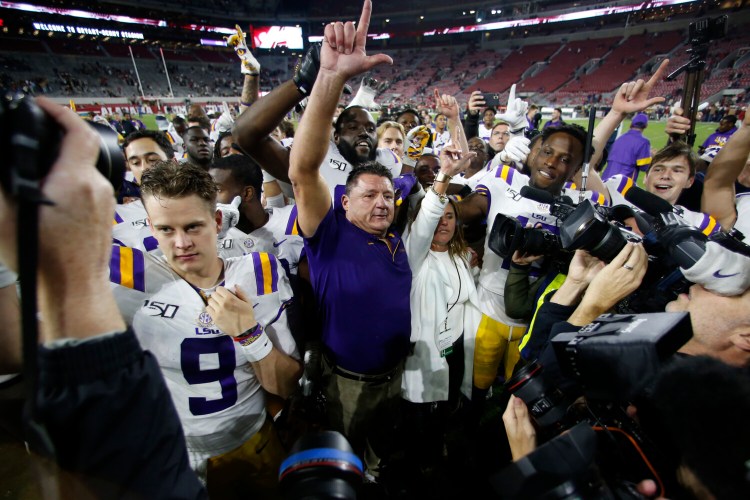 Coach Ed Orgeron and LSU jumped to the top spot in the CFP poll after Saturday's win over Alabama, which fell to fifth.
