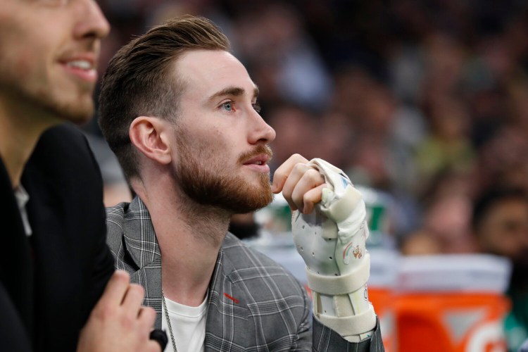 Injured Boston Celtics player Gordon Hayward watches from the bench during the second quarter of the team's game against the Washington Wizards on Wednesday. 