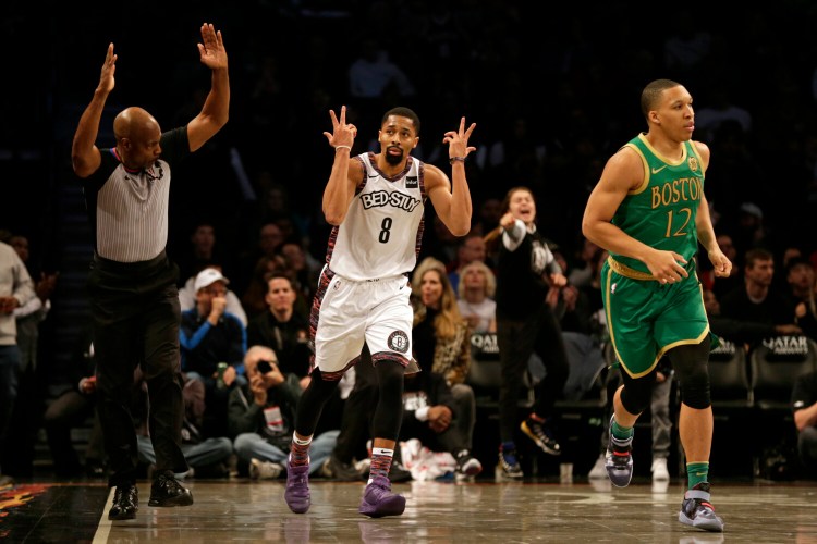 Guard Spencer Dinwiddie had 32 points and 11 assists as the Nets beat the Celtics 112-107 on Friday in New York.