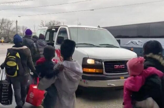 A group of asylum seekers boards a taxi after getting off a bus in Portland last month.