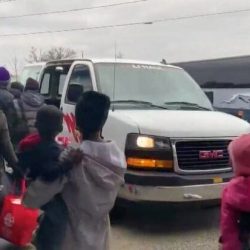 A group of asylum seekers boards a taxi after getting off a bus in Portland last month.