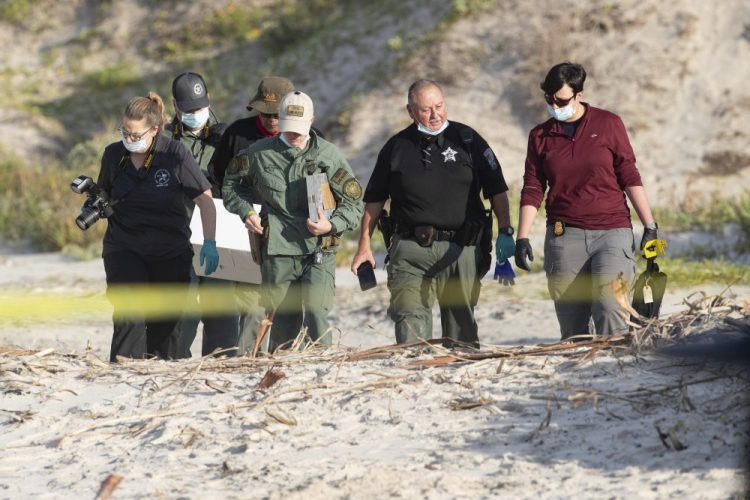 Officials in Texas are looking for a man and a woman who may have had contact with a New Hampshire couple whose bodies were found buried at a Corpus Christi beach, above, last month. 