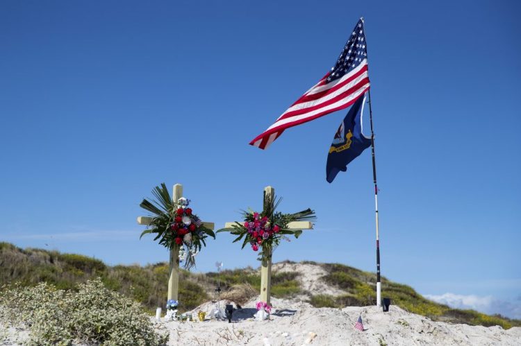 A makeshift memorial for James and Michelle Butler was erected on Padre Island Beach, Texas. The Butlers' deaths are being investigated as homicides. Their bodies were found last week in a shallow grave on Padre Island, near Corpus Christi, Texas.  