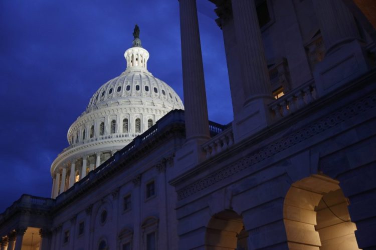 An annual congressional report says the U.S. budget deficit is likely to burst through the symbolic $1 trillion barrier this year despite a healthy economy.