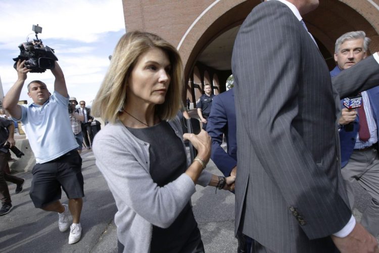 In this Aug. 27, 2019, file photo, actress Lori Loughlin departs federal court in Boston, after a hearing in a nationwide college admissions bribery scandal. 