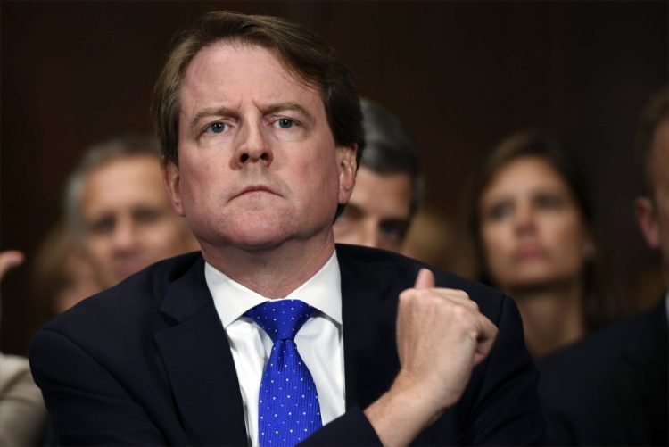 Former White House counsel Donald McGahn, shown in 2018, must testify before Congress in the impeachment inquiry, a federal judge ruled Monday. 