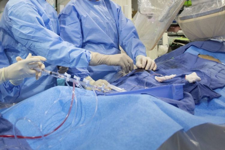 Surgeons perform a non-emergency angioplasty at Mount Sinai Hospital in New York. Through a blood vessel in the groin, a tube is guided to a blockage in the heart. A tiny balloon is then inflated to flatten the clog, and a mesh tube called a stent is inserted to prop the artery open. According to a federally funded study released Saturday, people with severe but stable heart disease from clogged arteries may have less chest pain if they get a procedure to improve blood flow rather than just giving medicines a chance to help, but it won't cut their risk of having a heart attack or dying over the following few years.