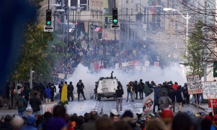 Seattle police use tear gas to push back World Trade Organization protesters on Nov. 30, 1999.  