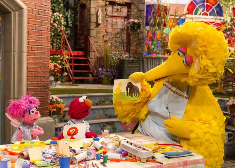 Characters, from left, Abby Cadabby, Elmo and Big Bird in a scene from "Sesame Street." The popular children's TV show is celebrating its 50th season. 