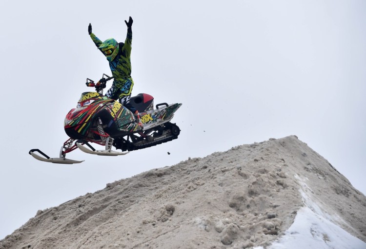 A stunt rider with RaveX performs at the Snodeo in Rangeley in 2017. 