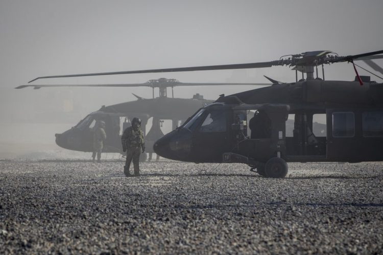 Blackhawk helicopters are parked at a U.S. military base at undisclosed location in Eastern Syria, Monday, Nov. 11, 2019. A senior U.S. coalition commander said Friday, Nov. 15,  the partnership with Syrian Kurdish forces remains strong and focused on fighting the Islamic State group, despite an expanding Turkish incursion on areas of Kurdish control.