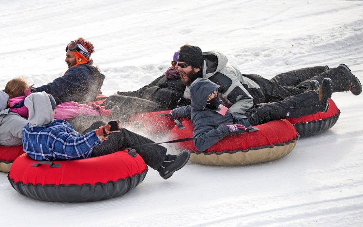 A gaggle of tubers caravan down the hill on the first day Eaton Mountain in Skowhegan was open in 2018: Monday, Dec. 31. The mountain is closed this year as the owners regroup to decide the area's future.