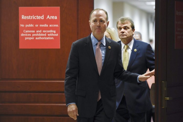 House Intelligence Committee Chairman Adam Schiff, D-Calif., followed by Rep. Mike Quigley, D-Ill., walks out to talk to reporters on Capitol Hill in Washington on Wednesday about the House impeachment inquiry. 