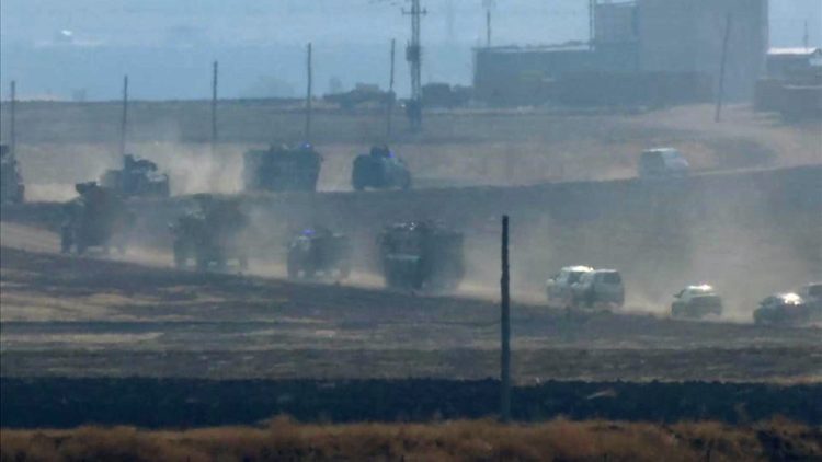 Military vehicles move in convoy along a road in Sevimli, Mardin Province, Turkey on Friday Nov. 1, 2019.  Turkey and Russia launched joint patrols Friday in northeastern Syria, under a deal that halted a Turkish offensive against Syrian Kurdish fighters who were forced to withdraw from the border area following Ankara's incursion. 