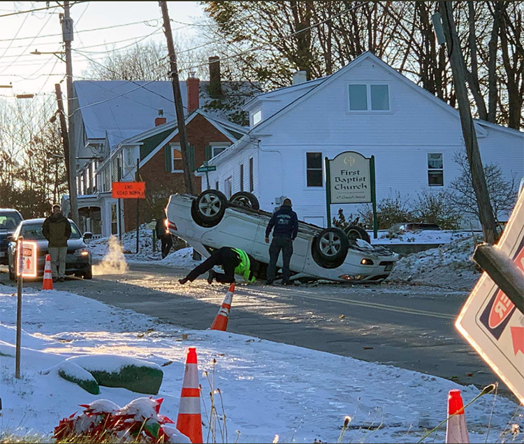 No one was injured Wednesday afternoon when a car driving up the hill on Church Street in Gardiner struck a utility pole and flipped on its roof.