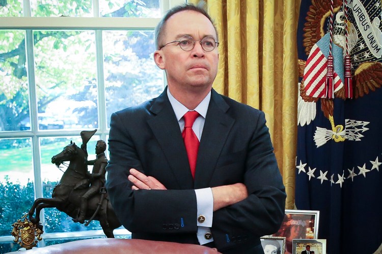 Acting White House chief of staff Mick Mulvaney listens as President Trump speaks during a meeting with Turkish President Recep Tayyip Erdogan in the Oval Office on Nov. 13.