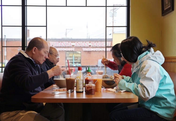 PORTLAND, ME - NOVEMBER 19: The Yeung family of Lewiston dines at Sun Vietnamese Restaurant, 699 Forest Ave., Portland. (Staff photo by Ben McCanna/Staff Photographer)